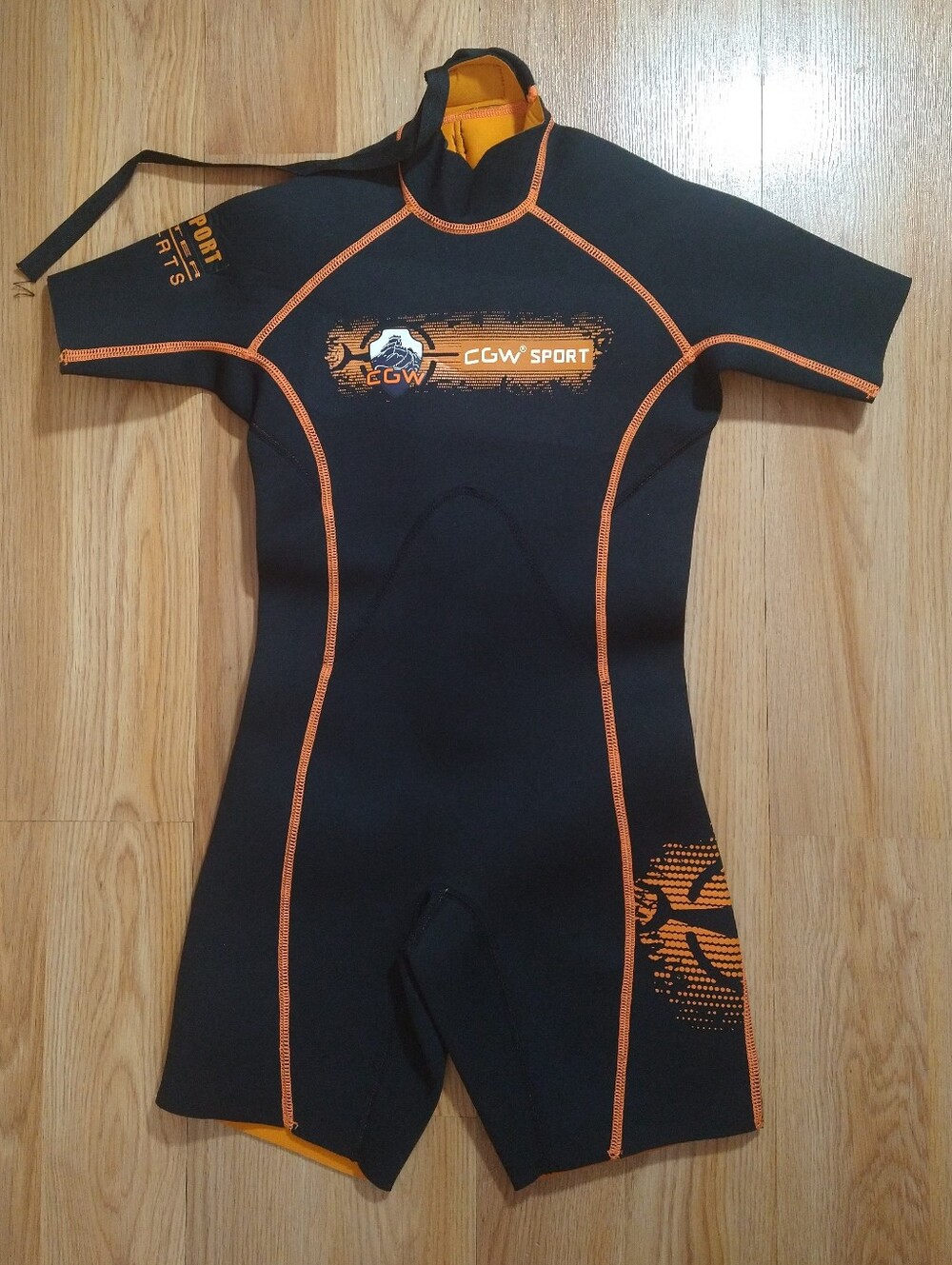 CGW Sport youth short leg scuba diving wetsuit in orange and black. 8/10